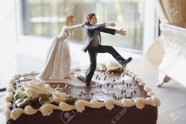 3729946-funny-wedding-cake-top-bride-chasing-groom